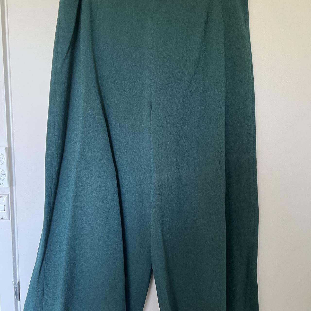 Gorman wide leg pants in green. Zip closure in the... Depop
