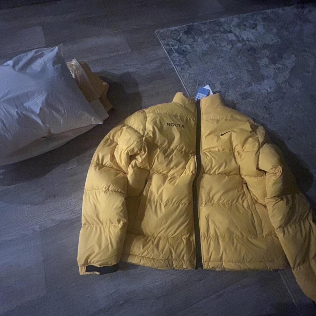 nocta university gold puffer jacket