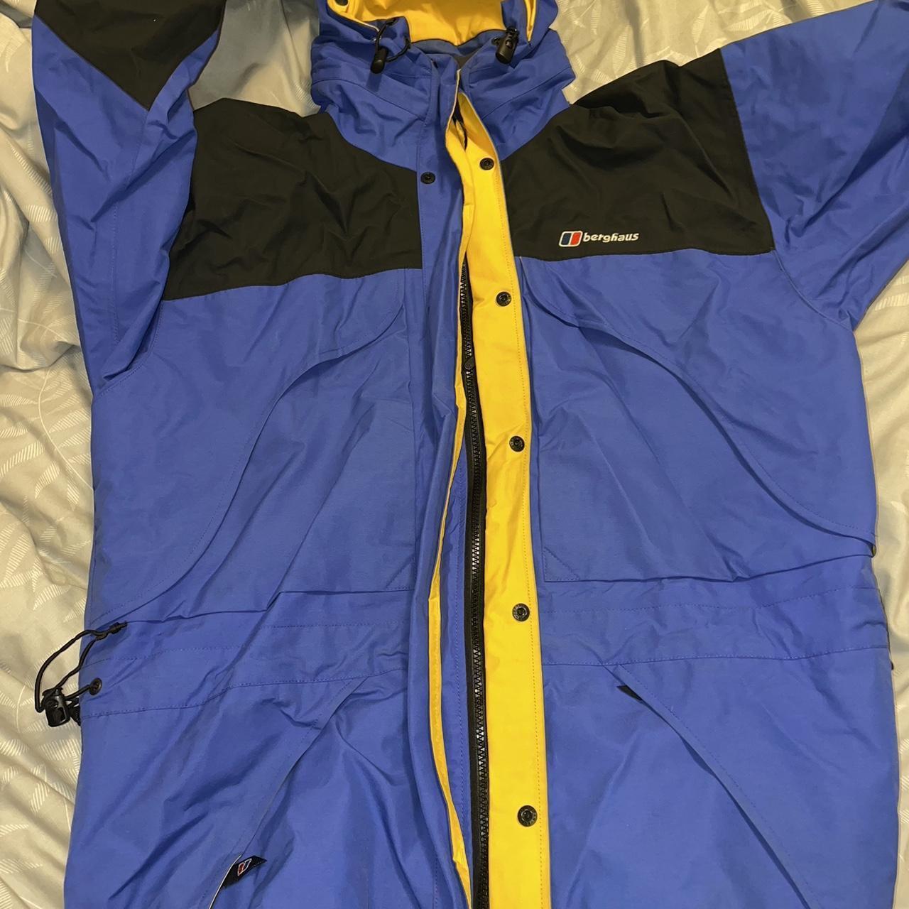 Berghaus mera peak jacket in blue good used... - Depop