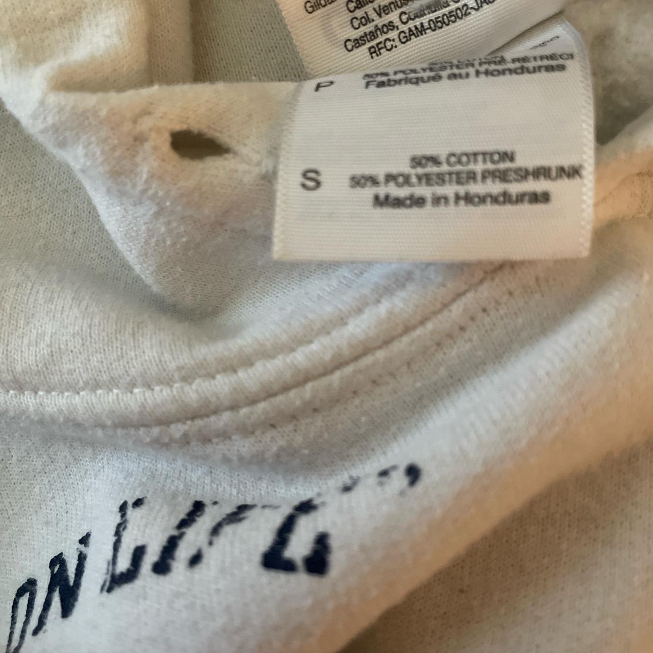 white sweatshirt with navy writing. size small. no... - Depop