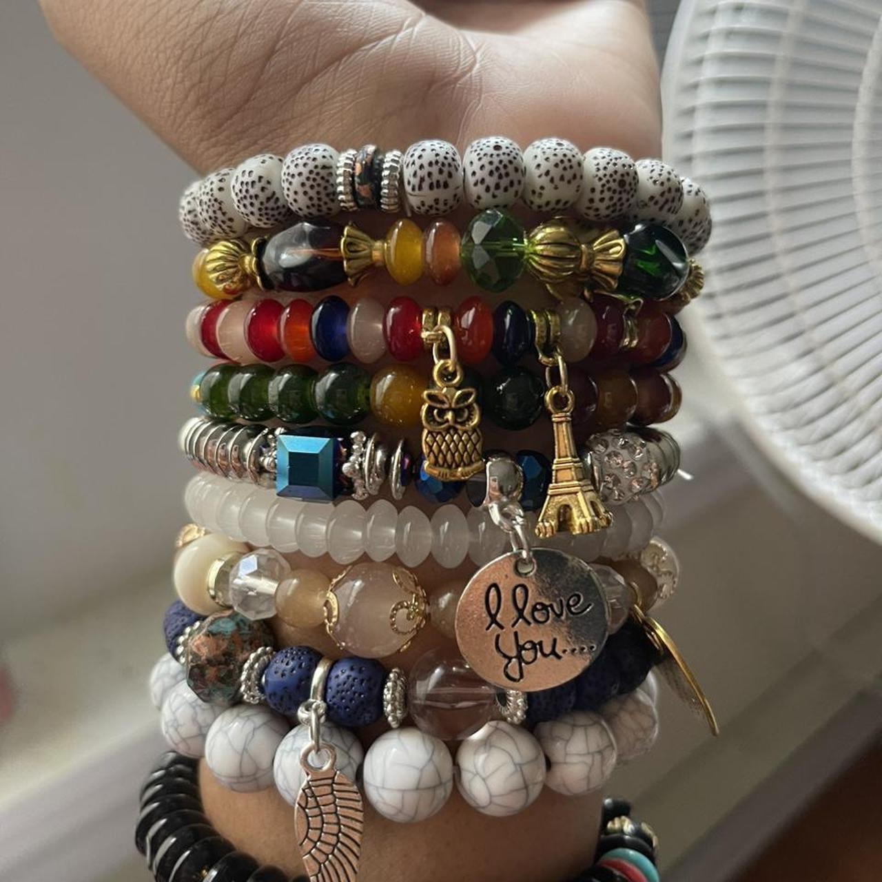clay beads bracelets. one is purple with a flower - Depop