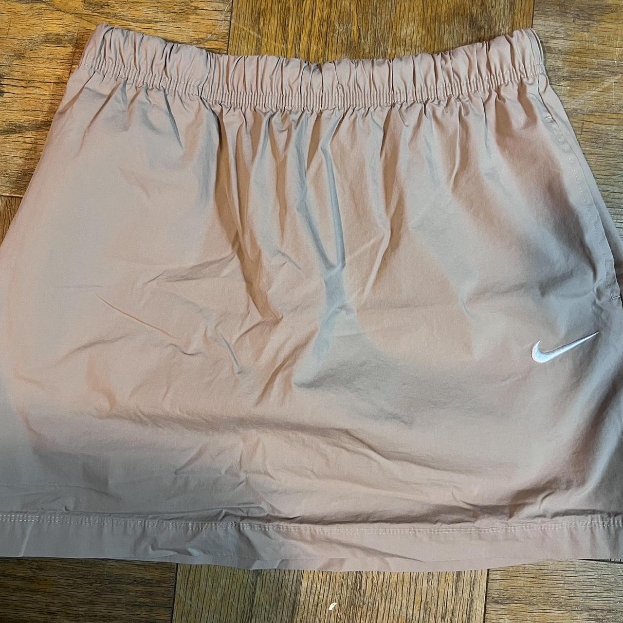 Nike tan khaki skirt with tie strings practically. Depop