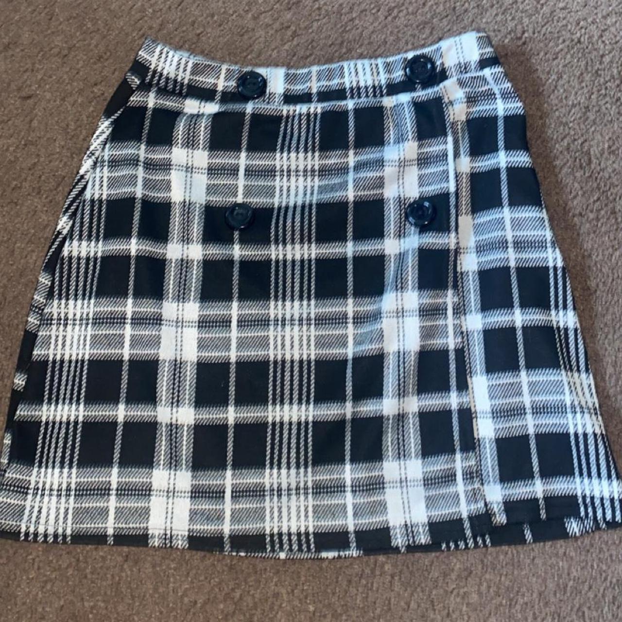 Black and white plaid mini skirt with a zipper on. Depop