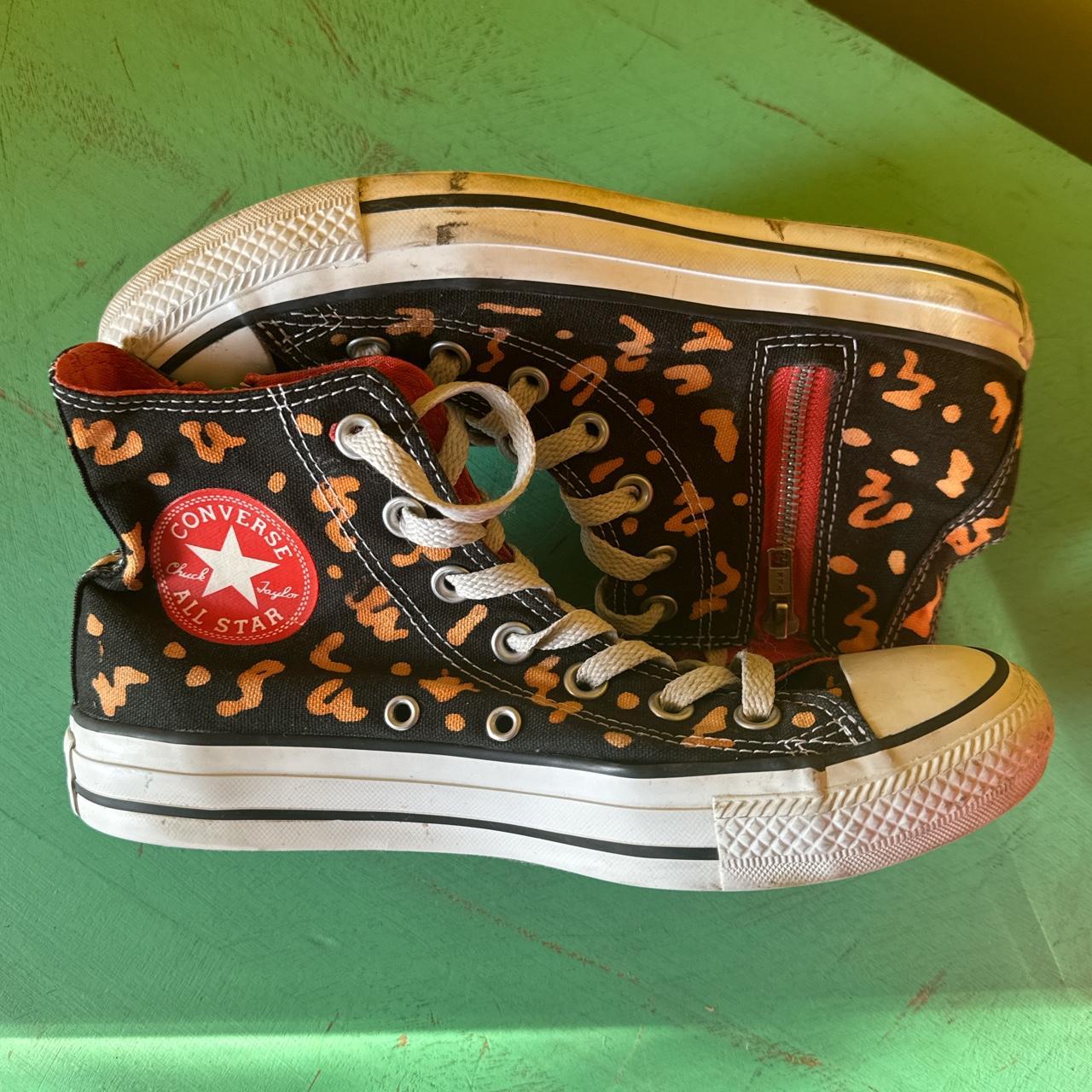 Black and orange top converse high tops