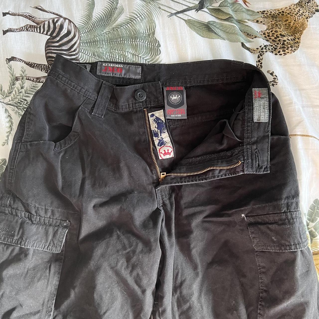 JNCO cargo jeans. Black cargos with embroidered... Depop