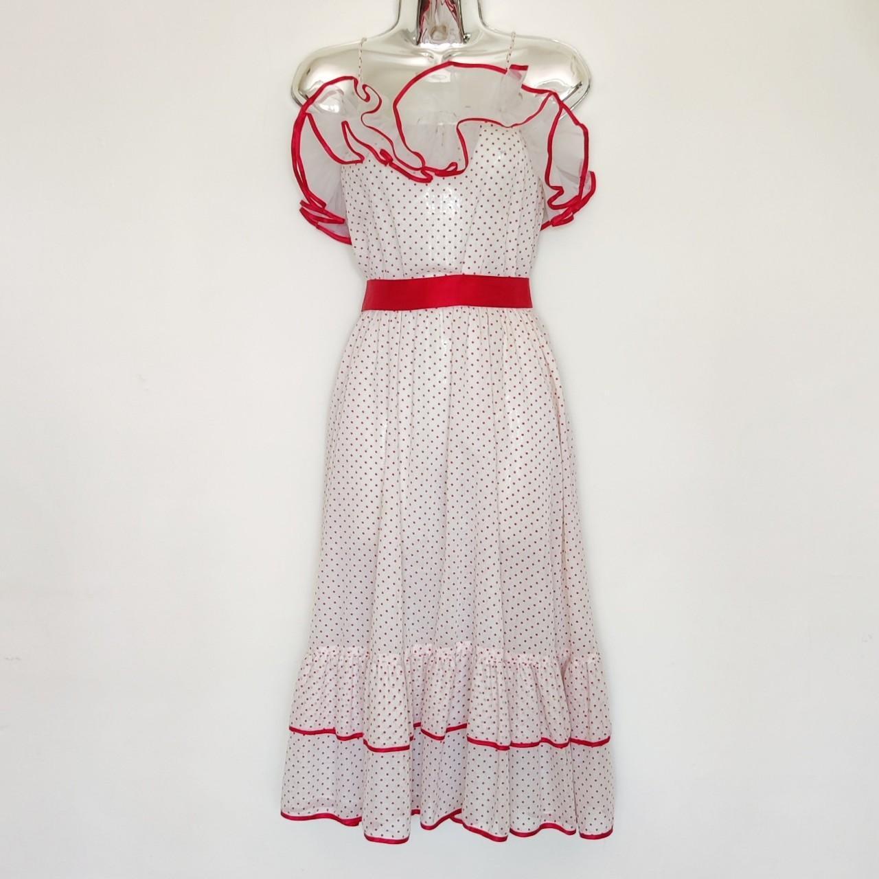 White dress on sale with red ribbon