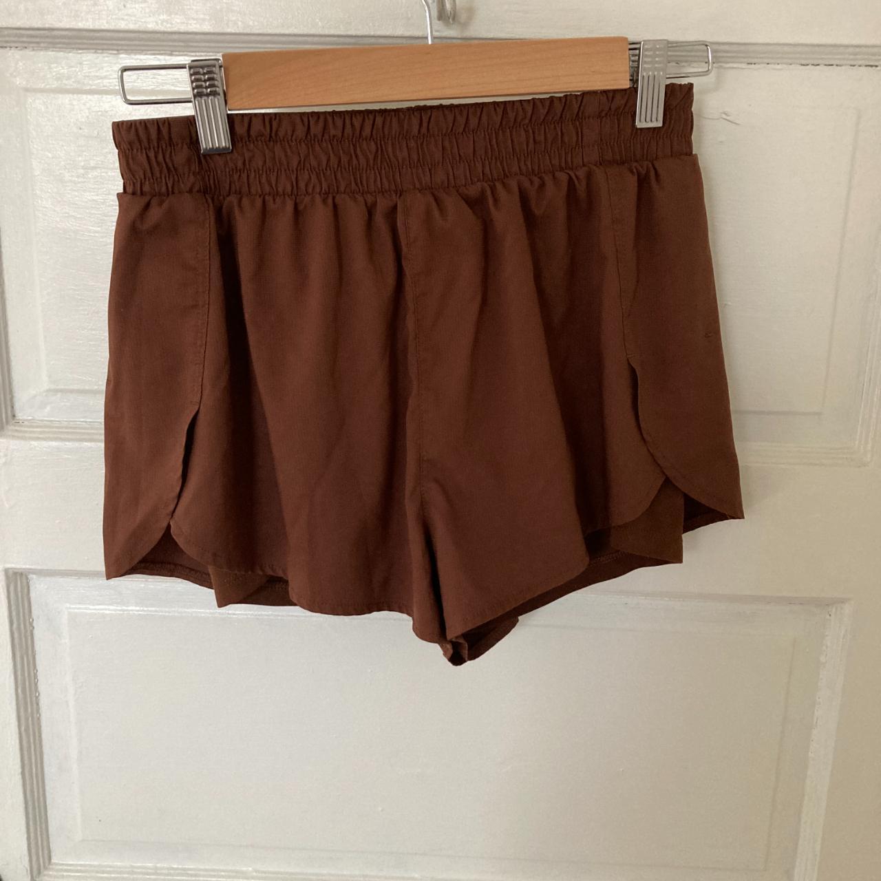 Girlfriend collective brown running shorts with... Depop