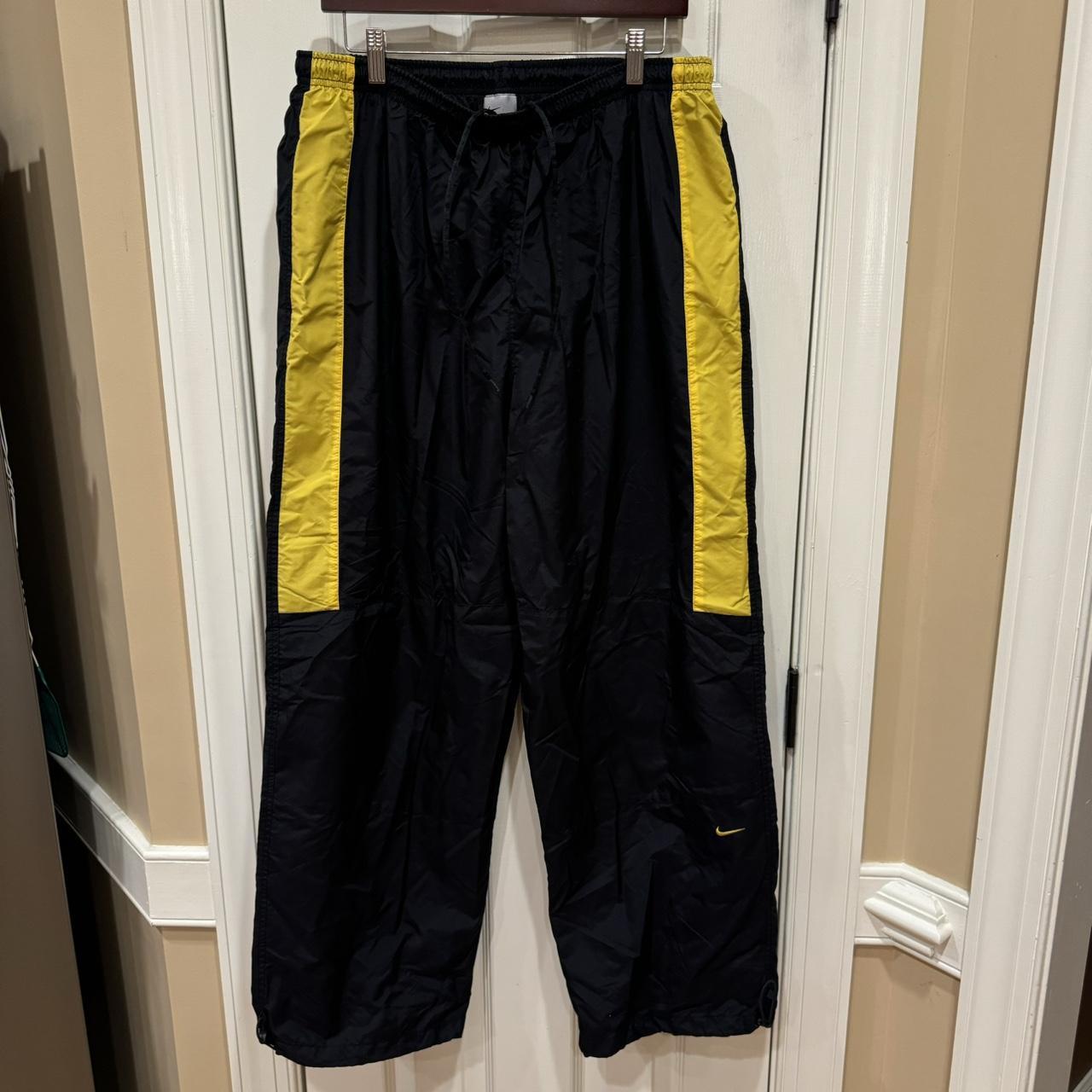 black and yellow nike joggers