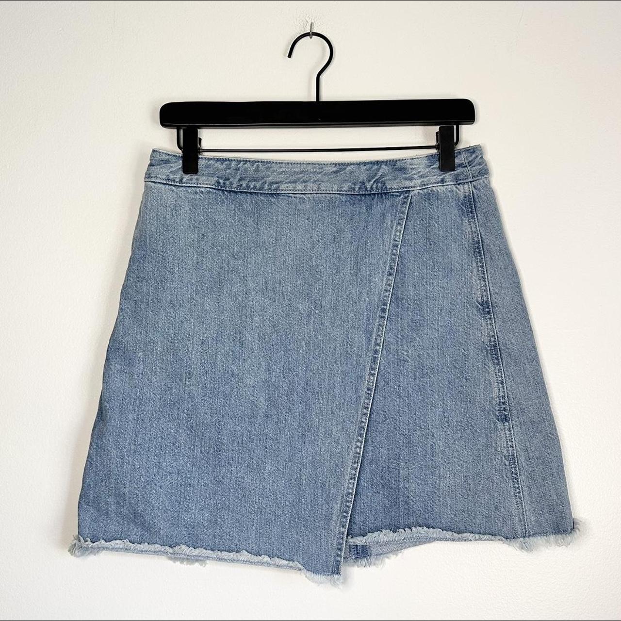 Asymmetrical denim wrap style mini skirt with raw...