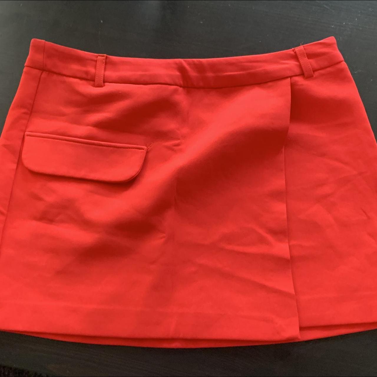 This is a bright red miniskirt with a false front... - Depop