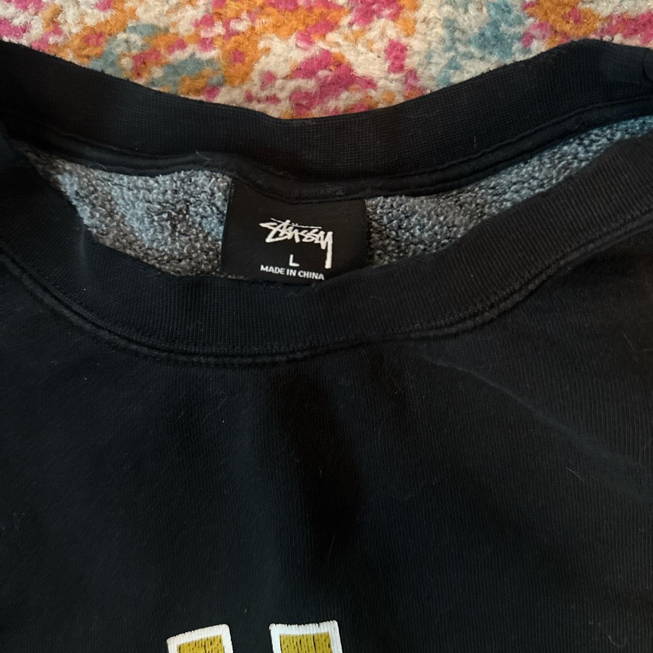 Stussy black and yellow pull over Small hole in left... - Depop