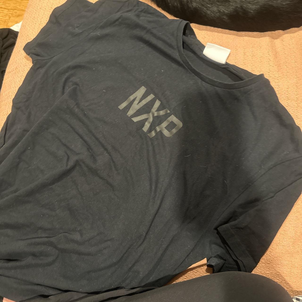 Nxp black t shirt Worn once (in better condition... - Depop