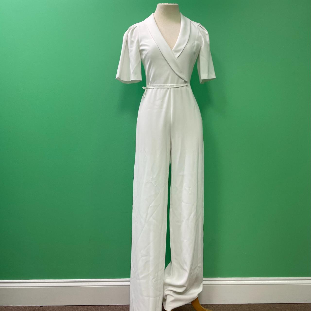 This jumpsuit's design showcases an artful blend of... Depop