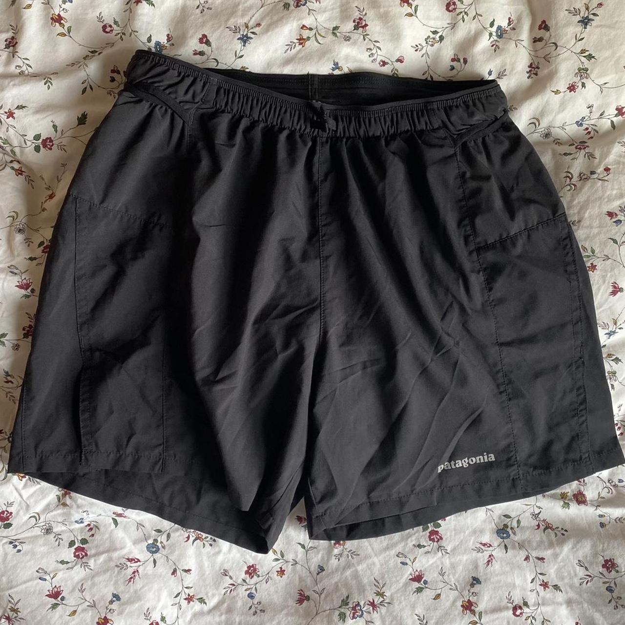 Patagonia black sports shorts with zip up pocket for... - Depop