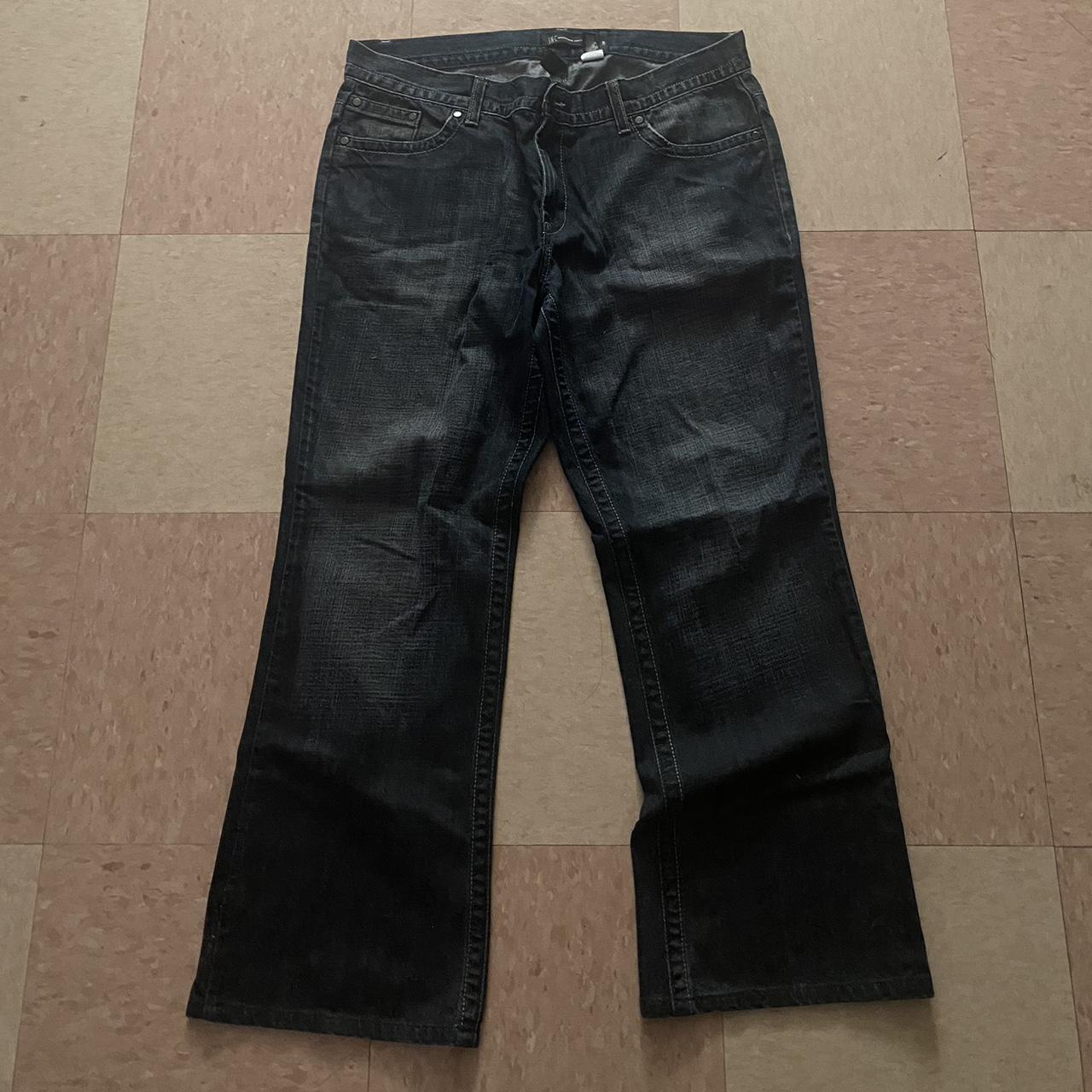 Flared jeans (kinda) The design on the back reminds... - Depop