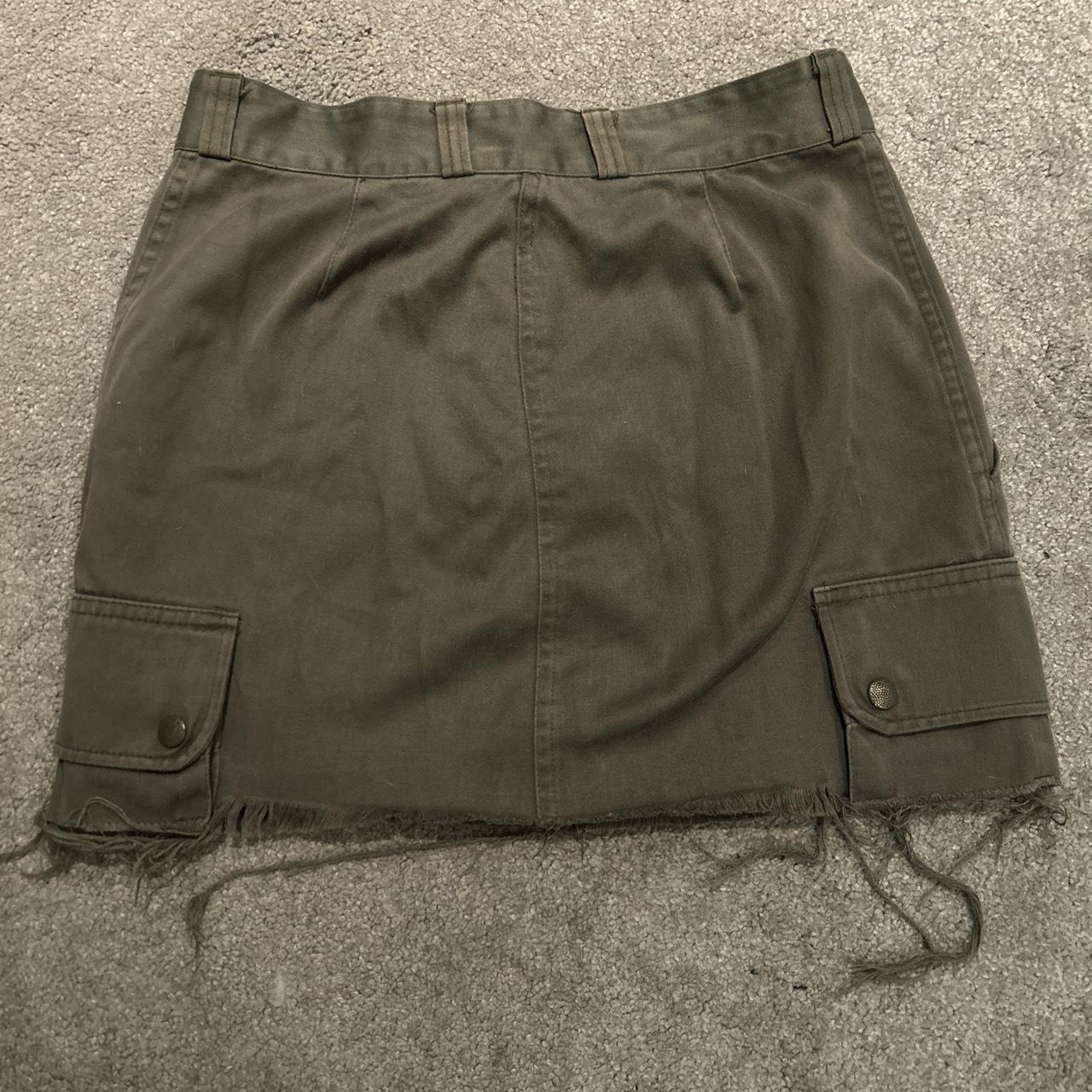 Khaki cargo mini skirt, size medium. Frayed edges.... - Depop