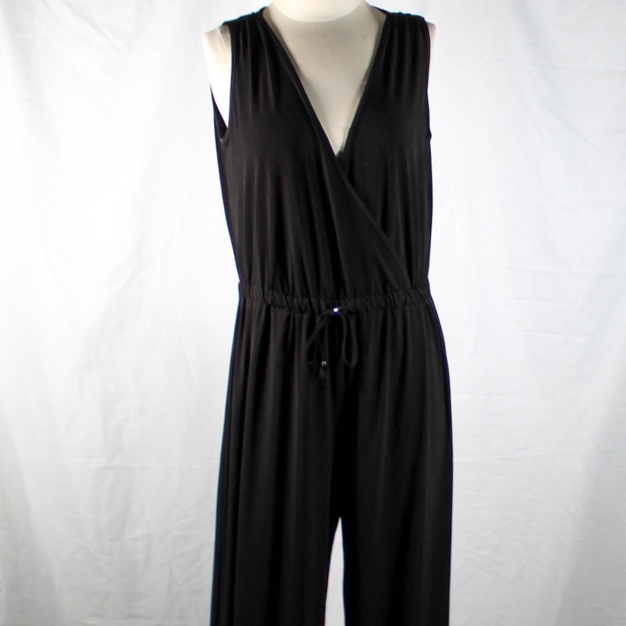 Need a classic black jumpsuit? This is a sleek black... - Depop