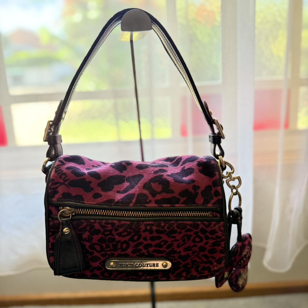 Iconic pink and black “Juicy Couture” leopard print...