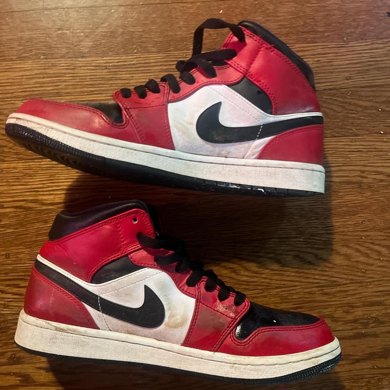half black half red jordan ones
