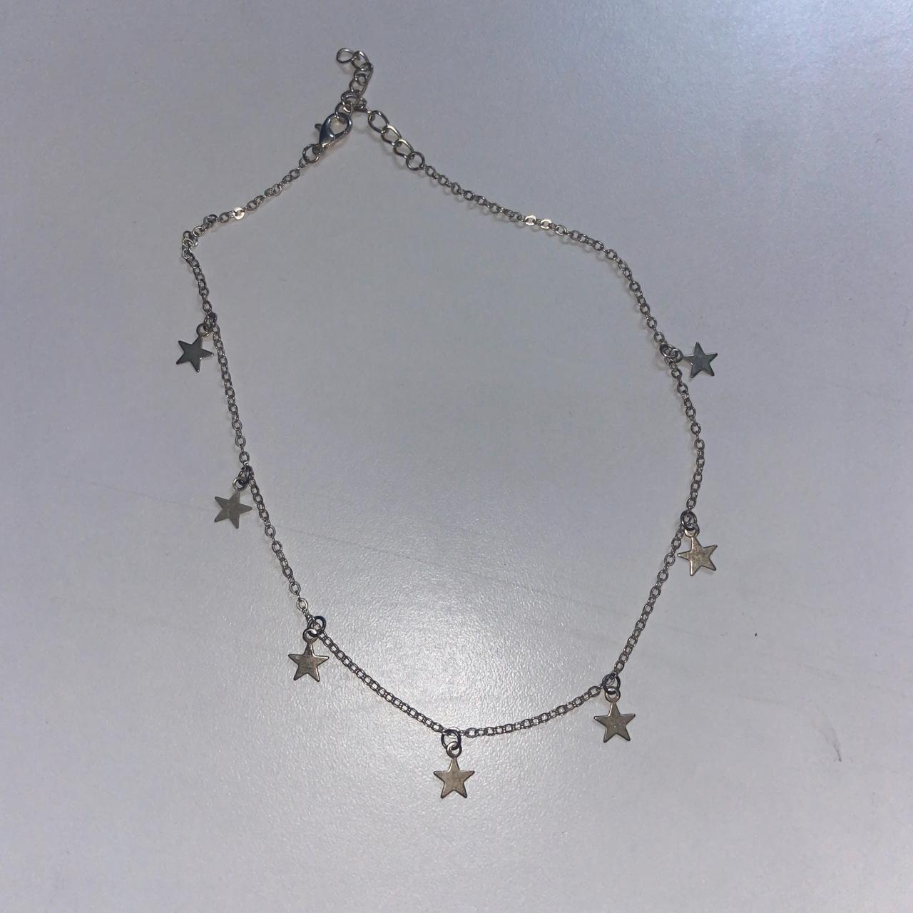 - Silver star necklace - Depop