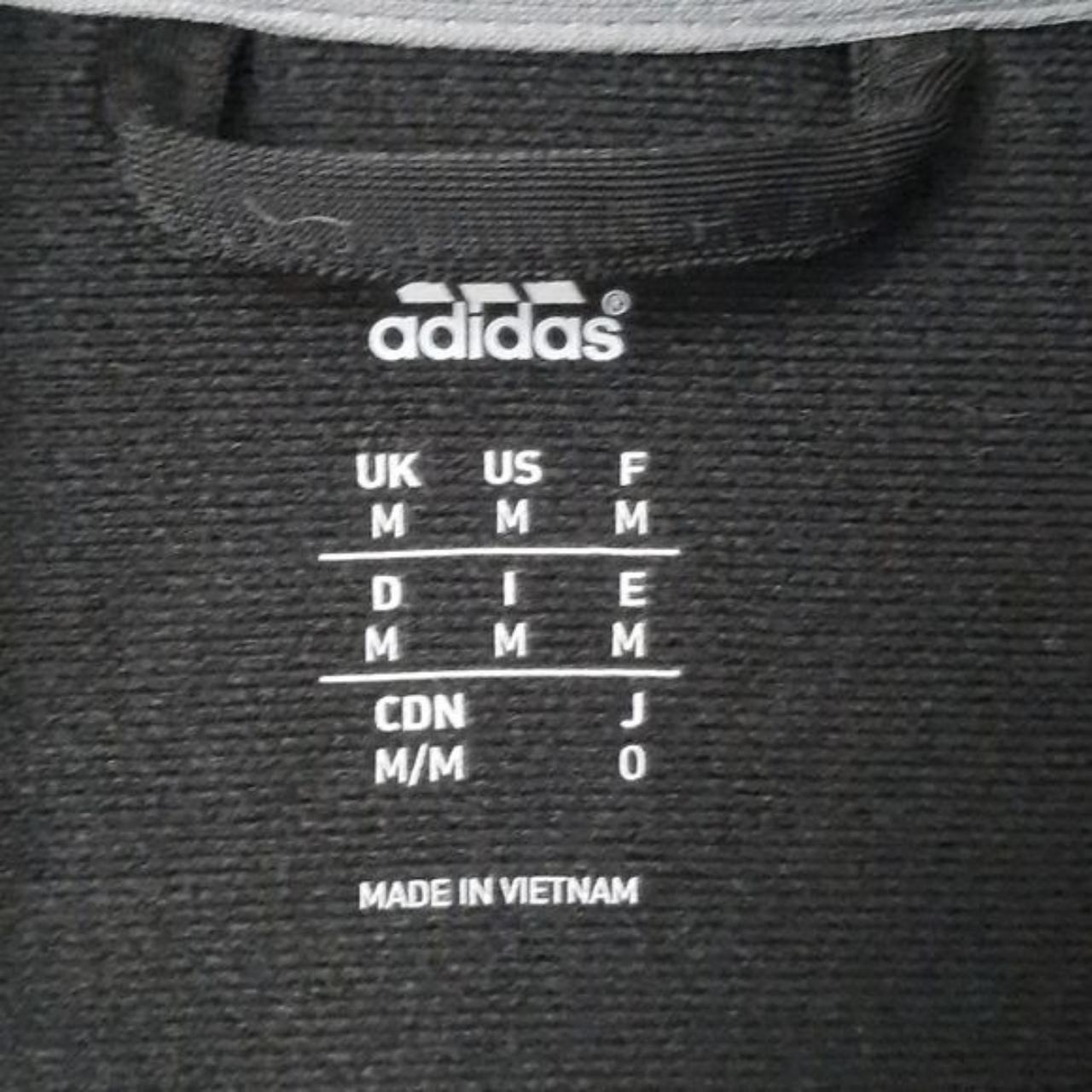 Adidas black jacket with white arm strips. 2... - Depop