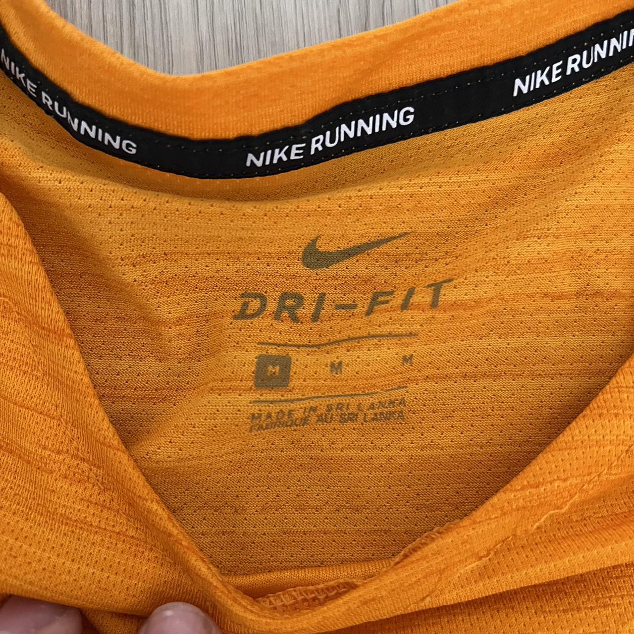 fluorescent orange nike shirt