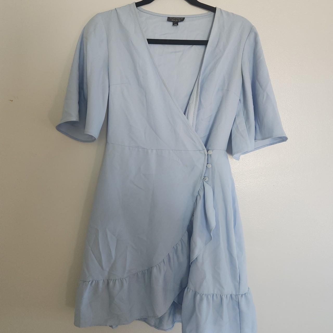 Lightly worn baby blue wrap dress. Ruffled hem, side... - Depop