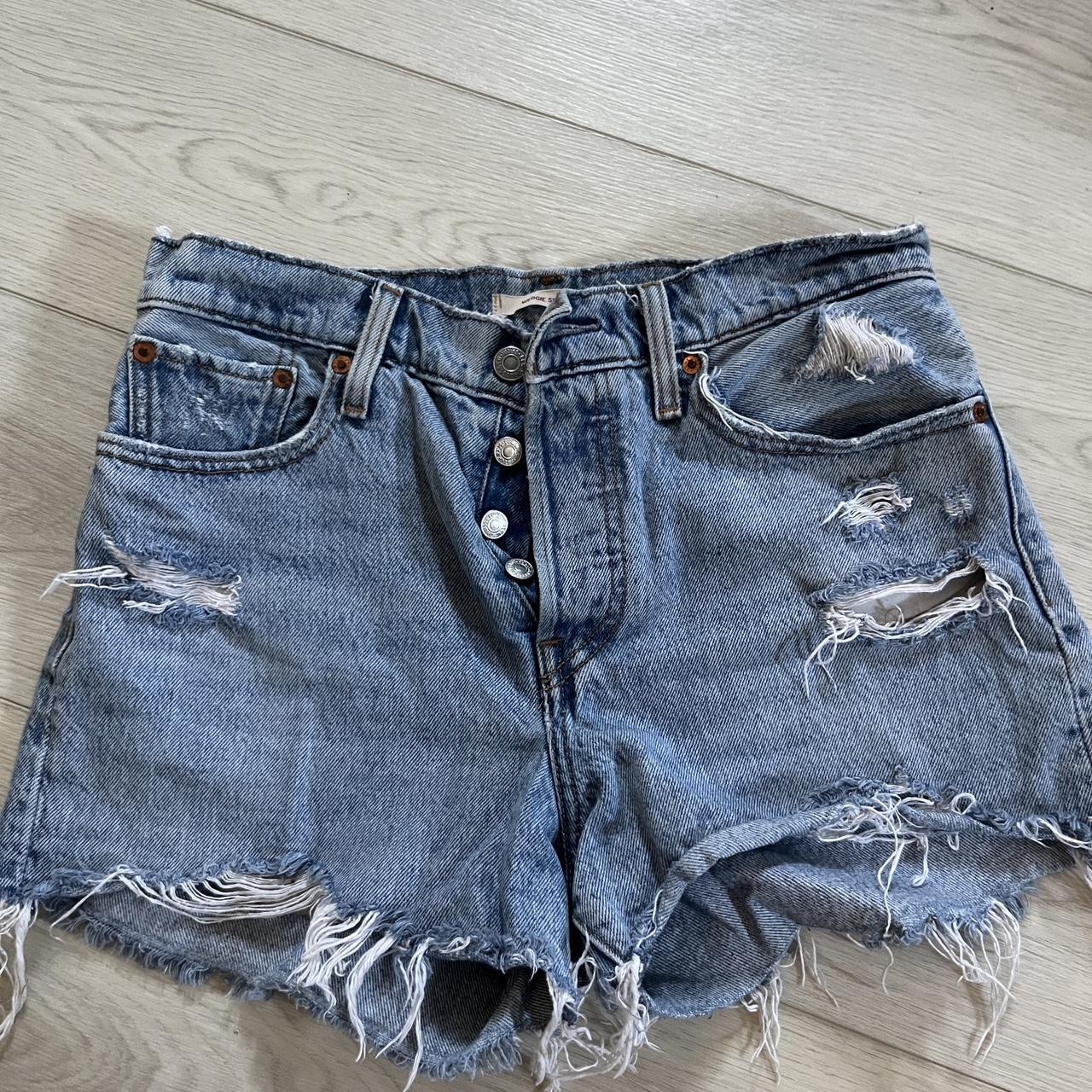 Levi booty shorts with rips Worn once , super good... - Depop