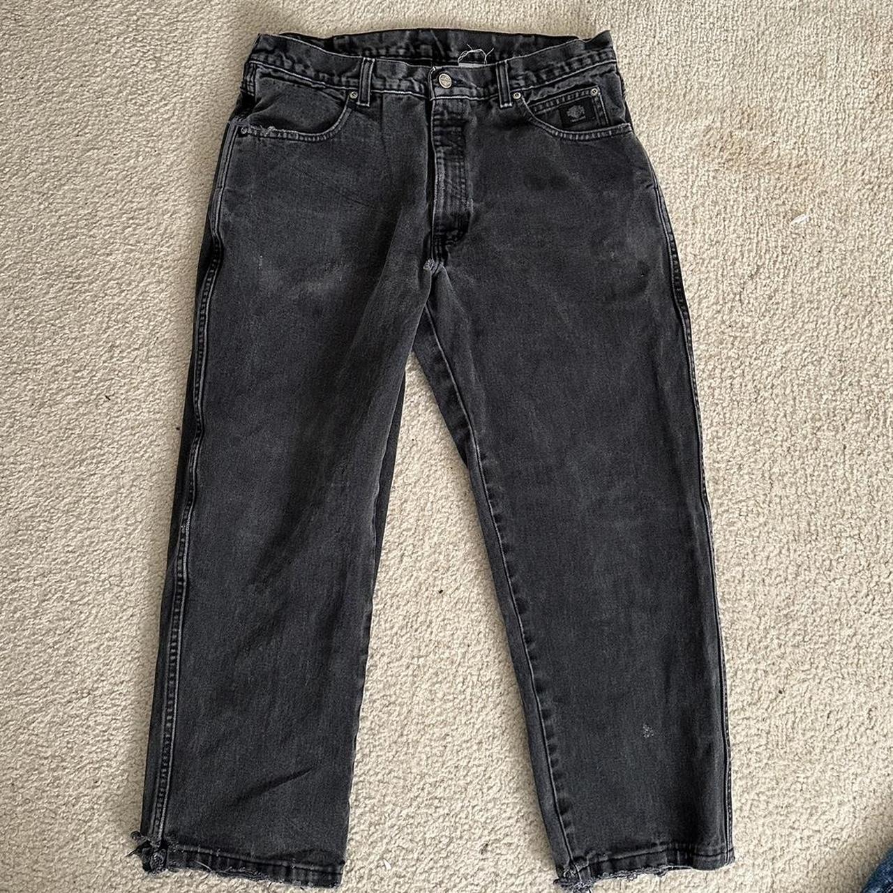 Black Harley Davidson jeans with some wear from... - Depop