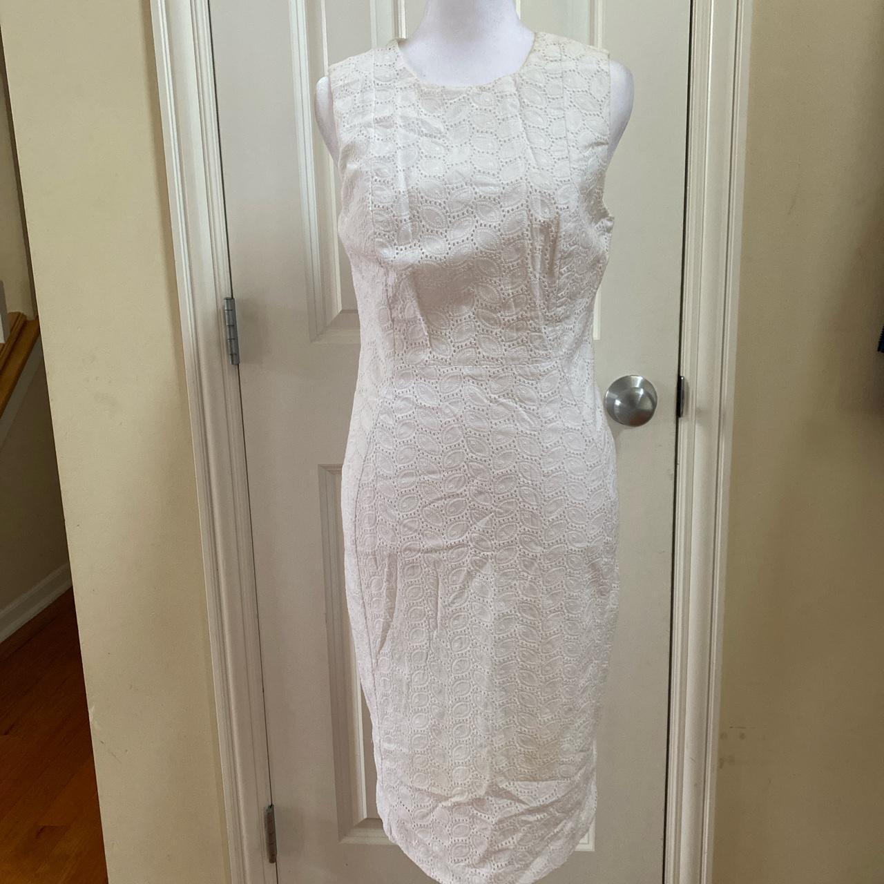 This is a Calvin Klein white lace bodycon dress