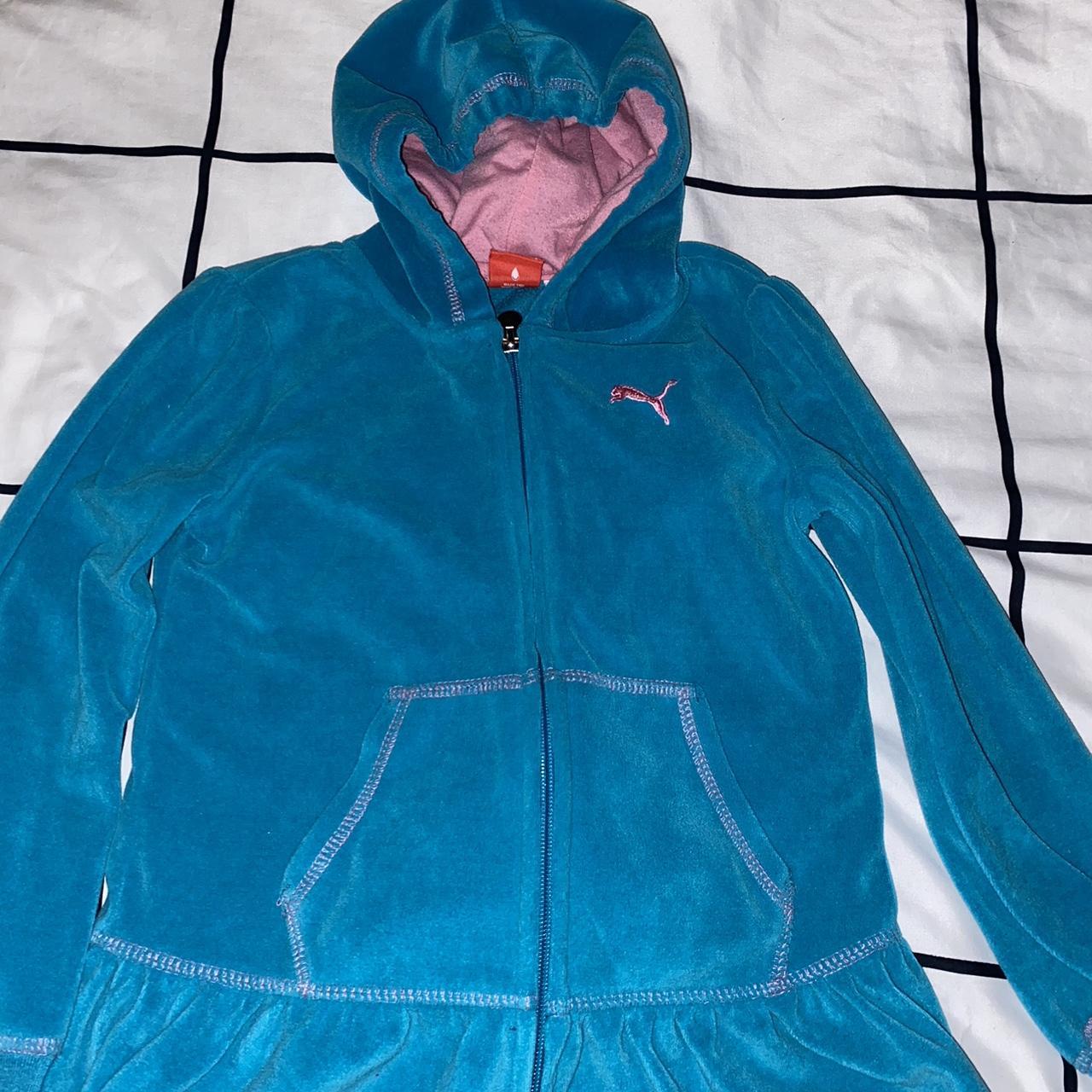 A cute teal velour puma jumpsuit with a pink hood