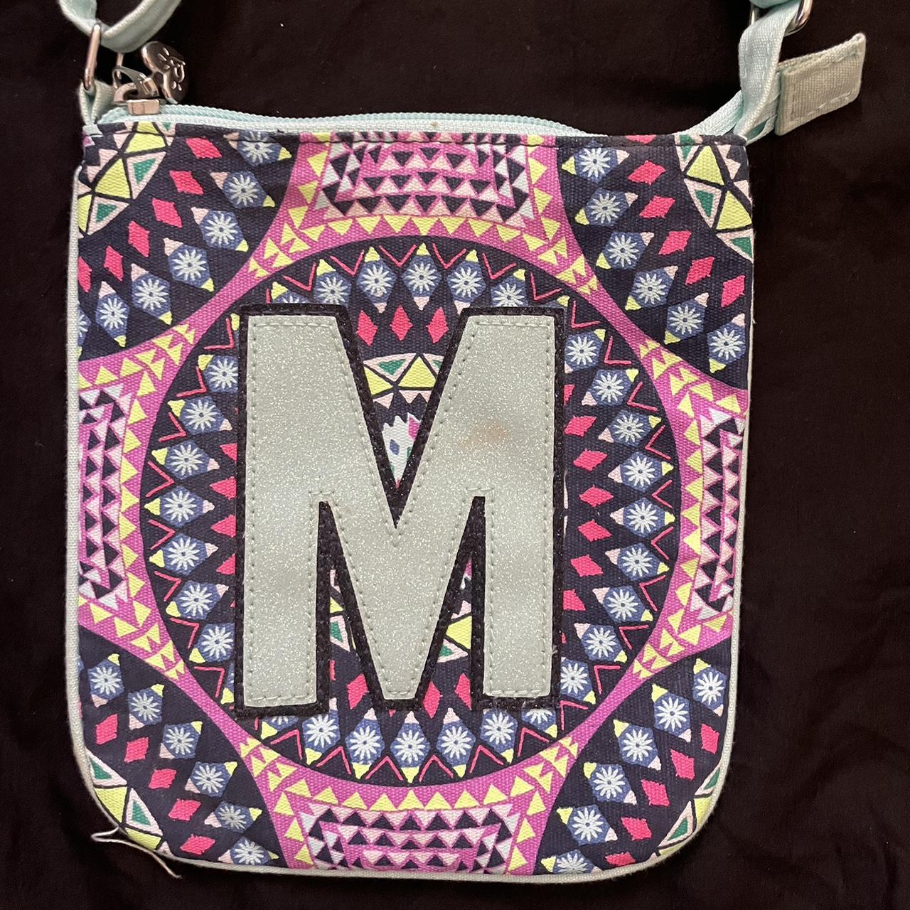 Justice letter “M” bag with pattern background.... Depop