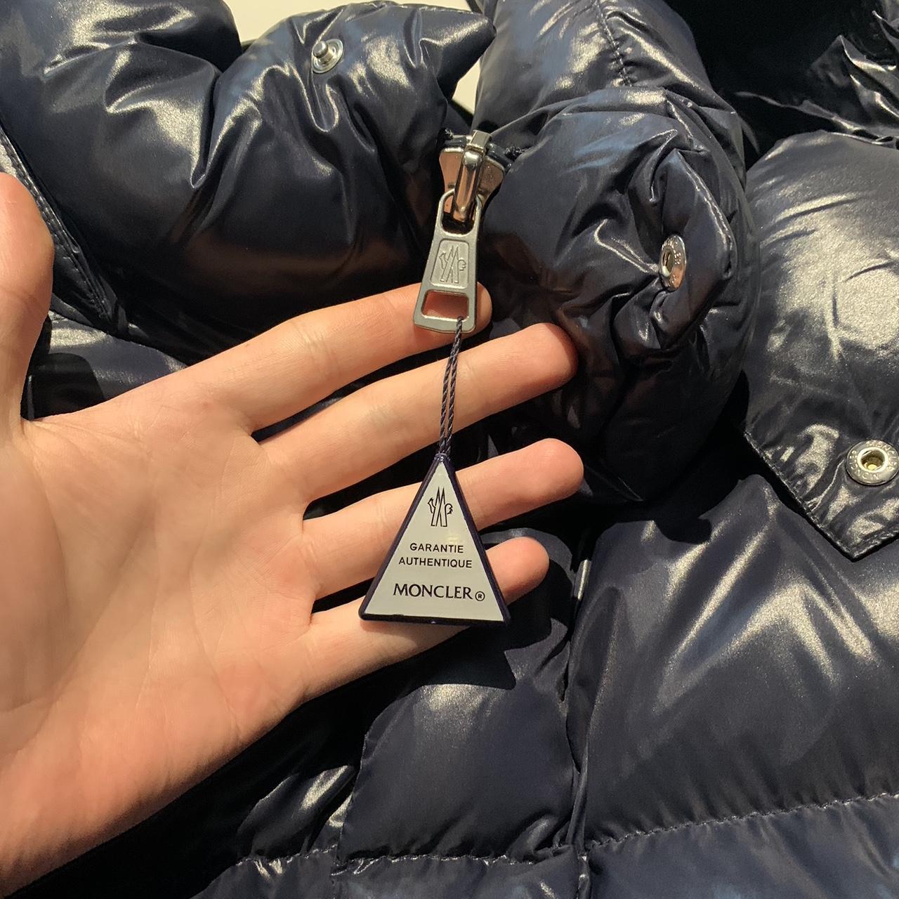 Moncler triangle tag online