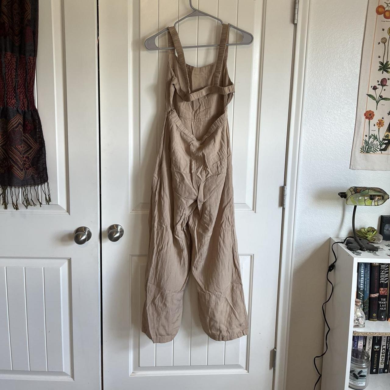 Super cute backless jumpsuit with a very light and... Depop