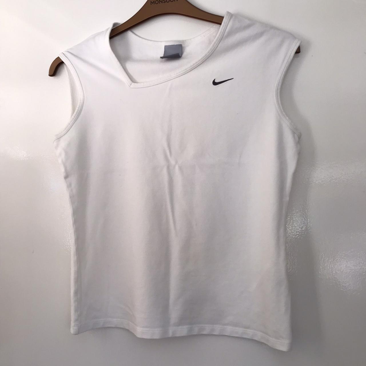 White Nike sports top. Slight mark as pictured. Size... - Depop