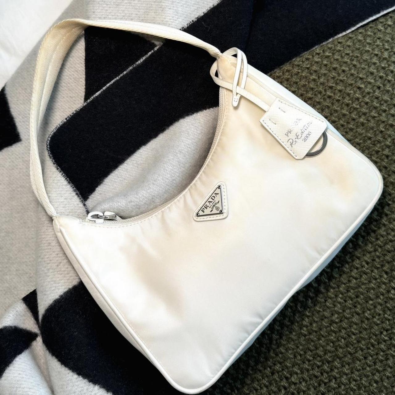 This pre loved white Prada bag is still in good Depop