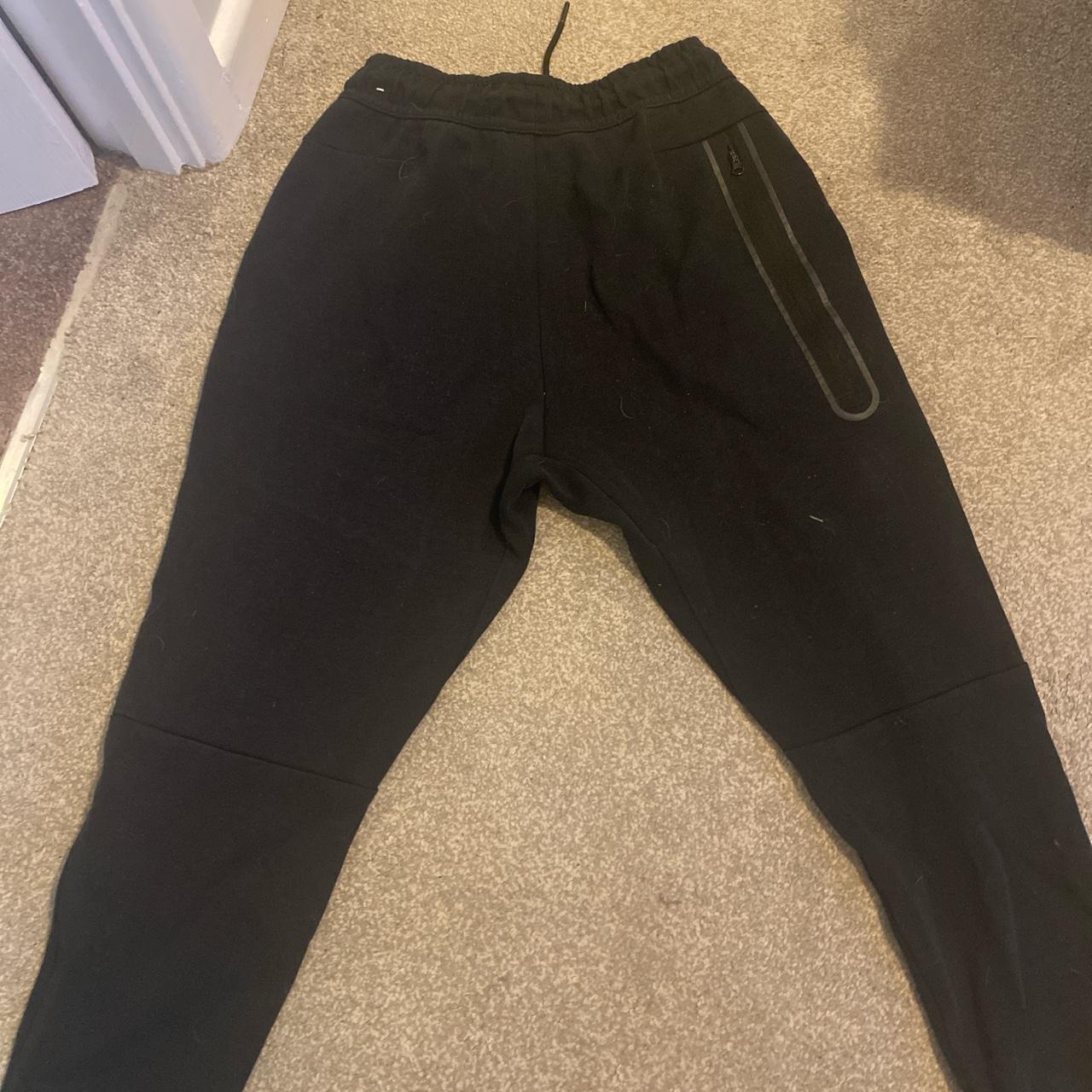 Black Nike tech fleece joggers junior size L normal... - Depop