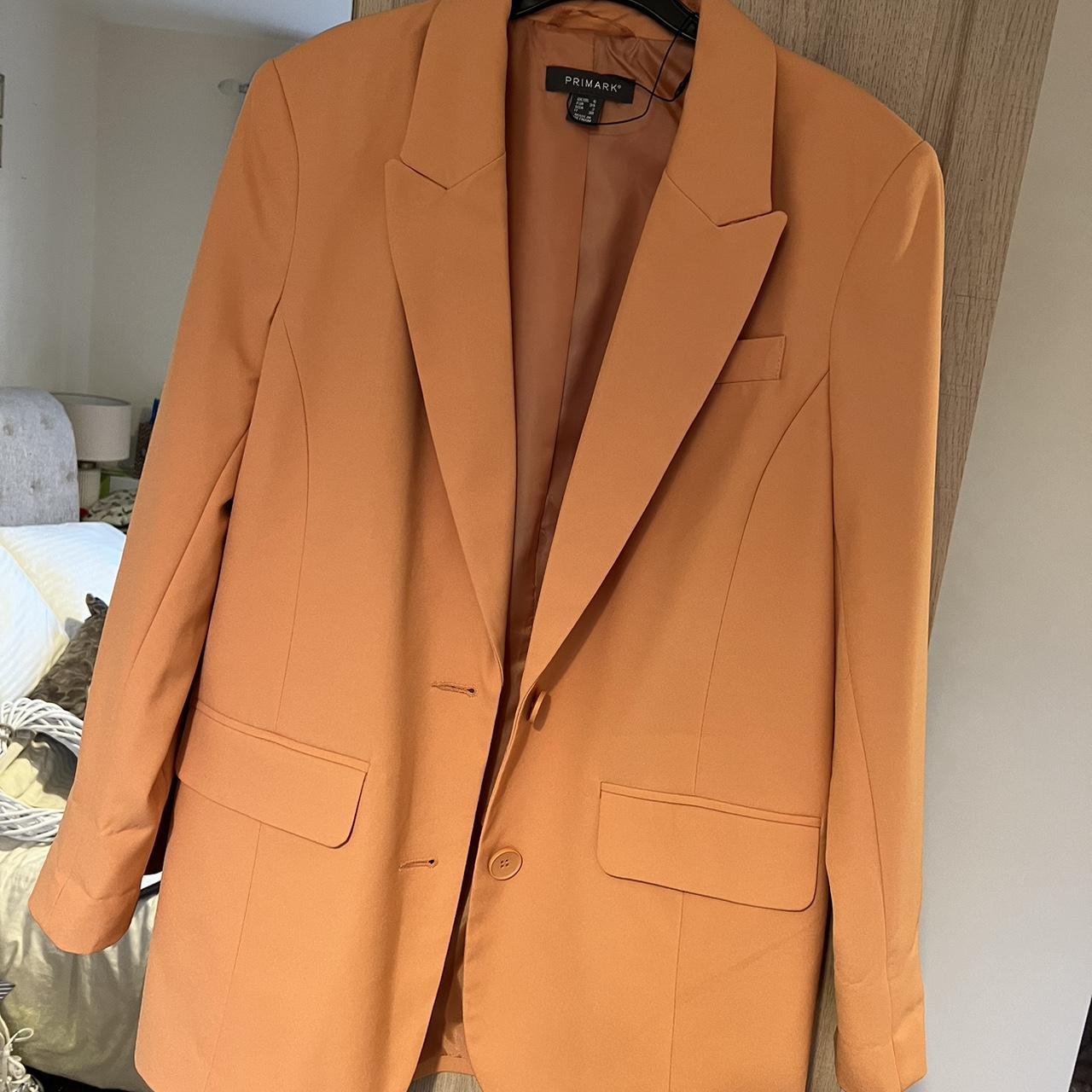 Primark shop orange jacket