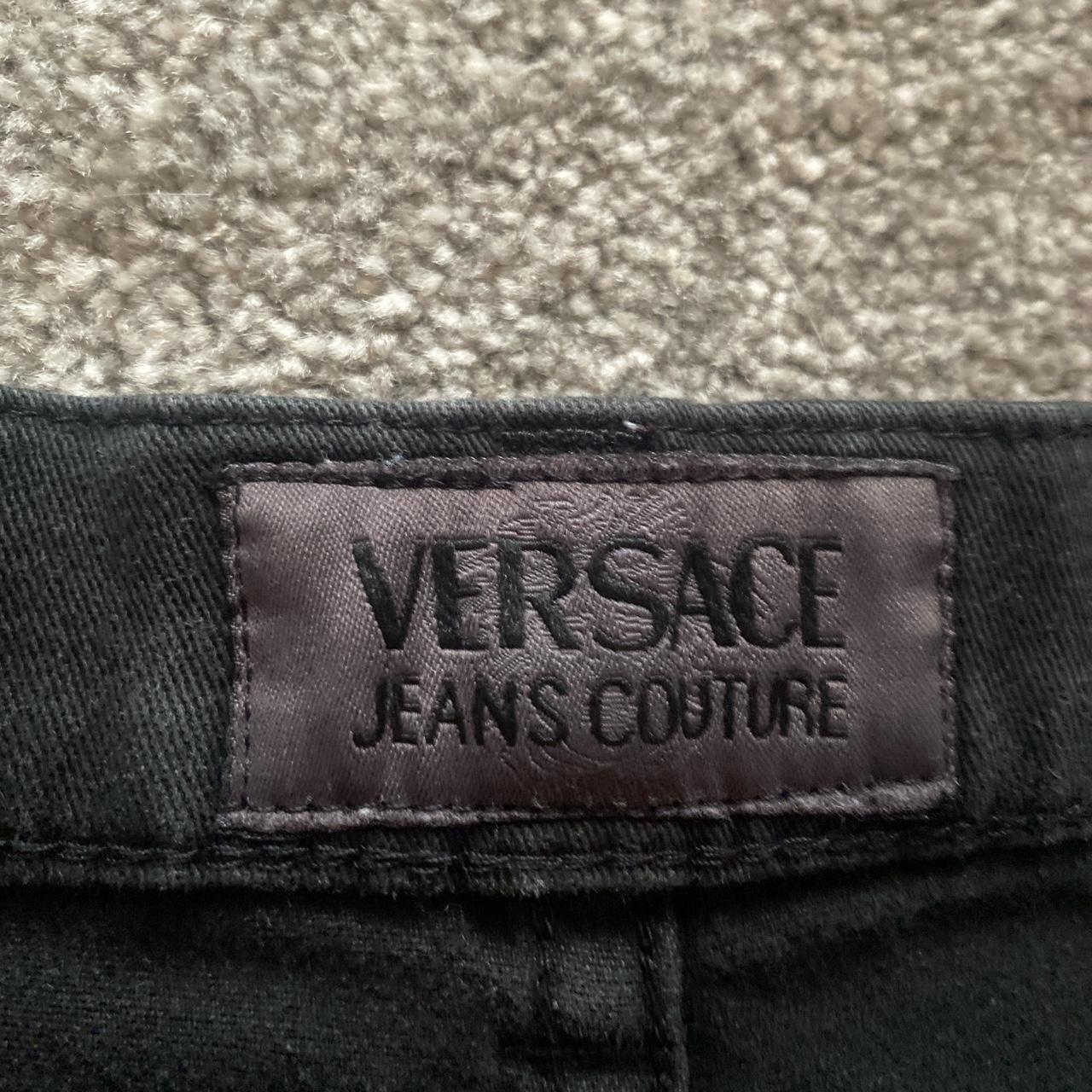 Black loose fitting Versace jeans couture... - Depop