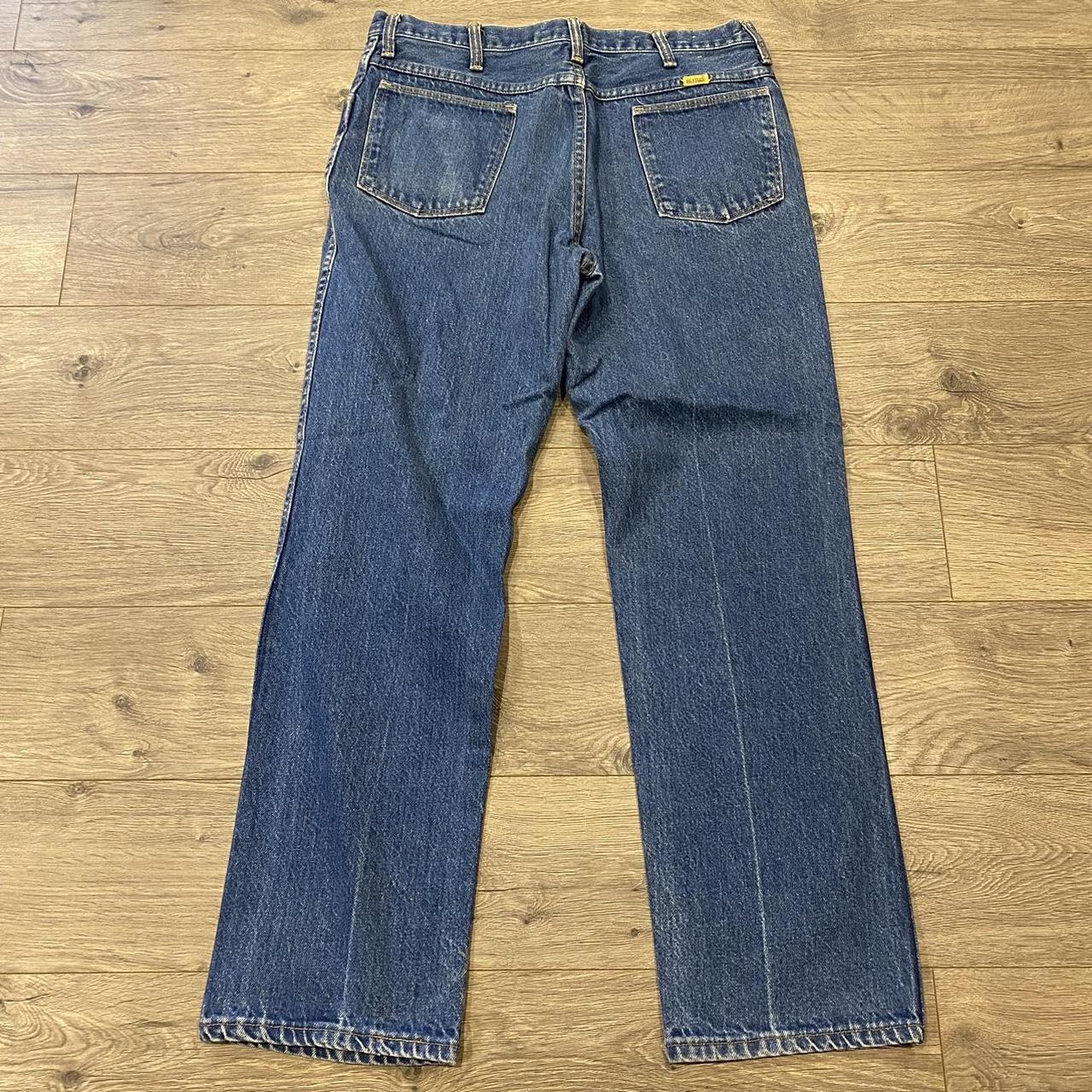 Blue jeans with yellow hot sale rips