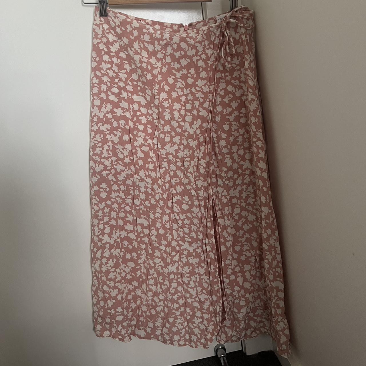 Kookai blush midi skirt size 40. Features a slit and... - Depop
