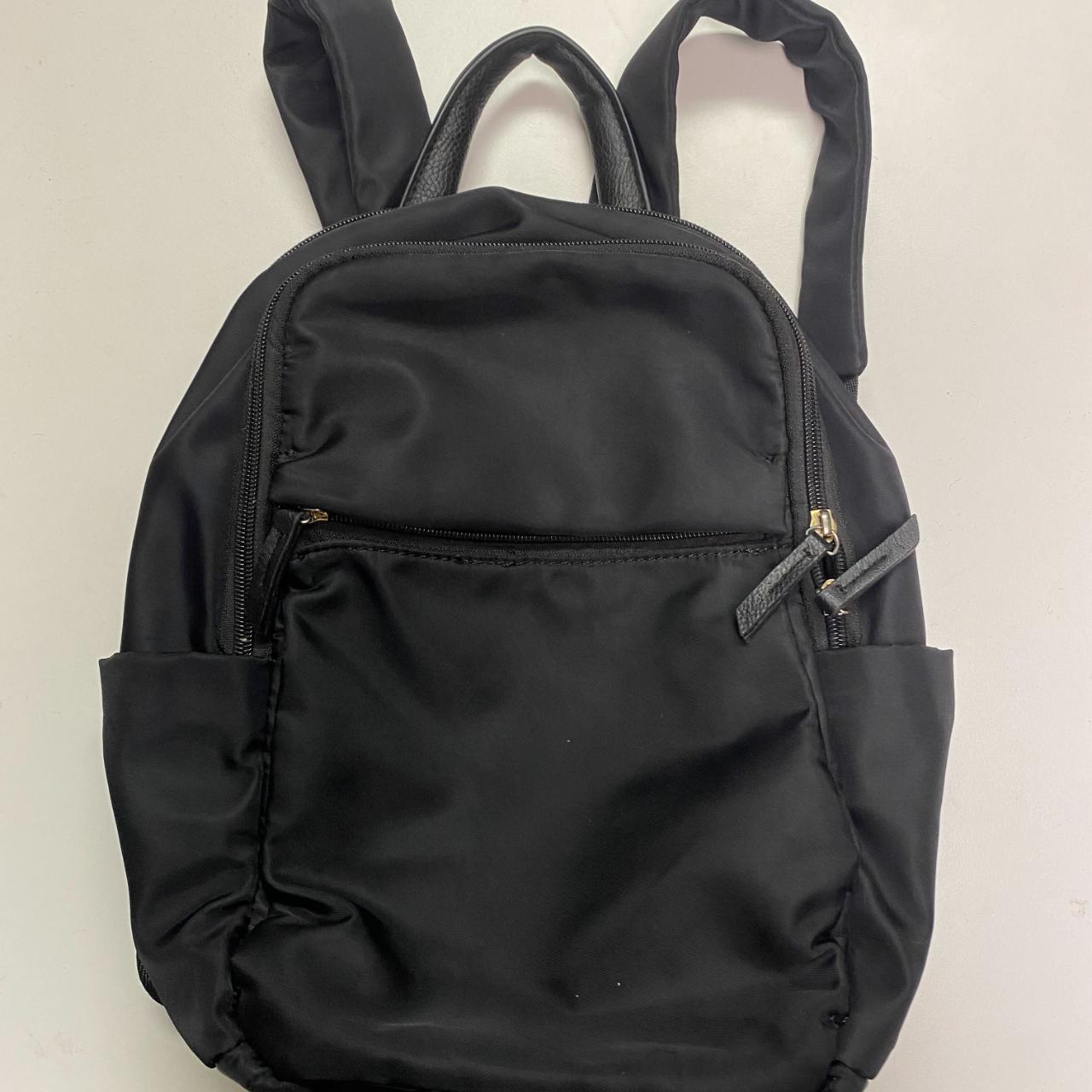 Black mini backpack with three zipper pockets on the... - Depop