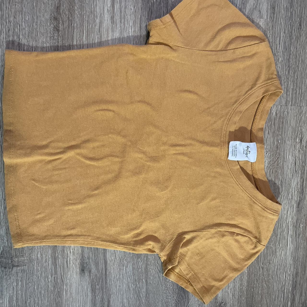 Tight fitted orange/yellow shirt. no flaws or marks.... Depop