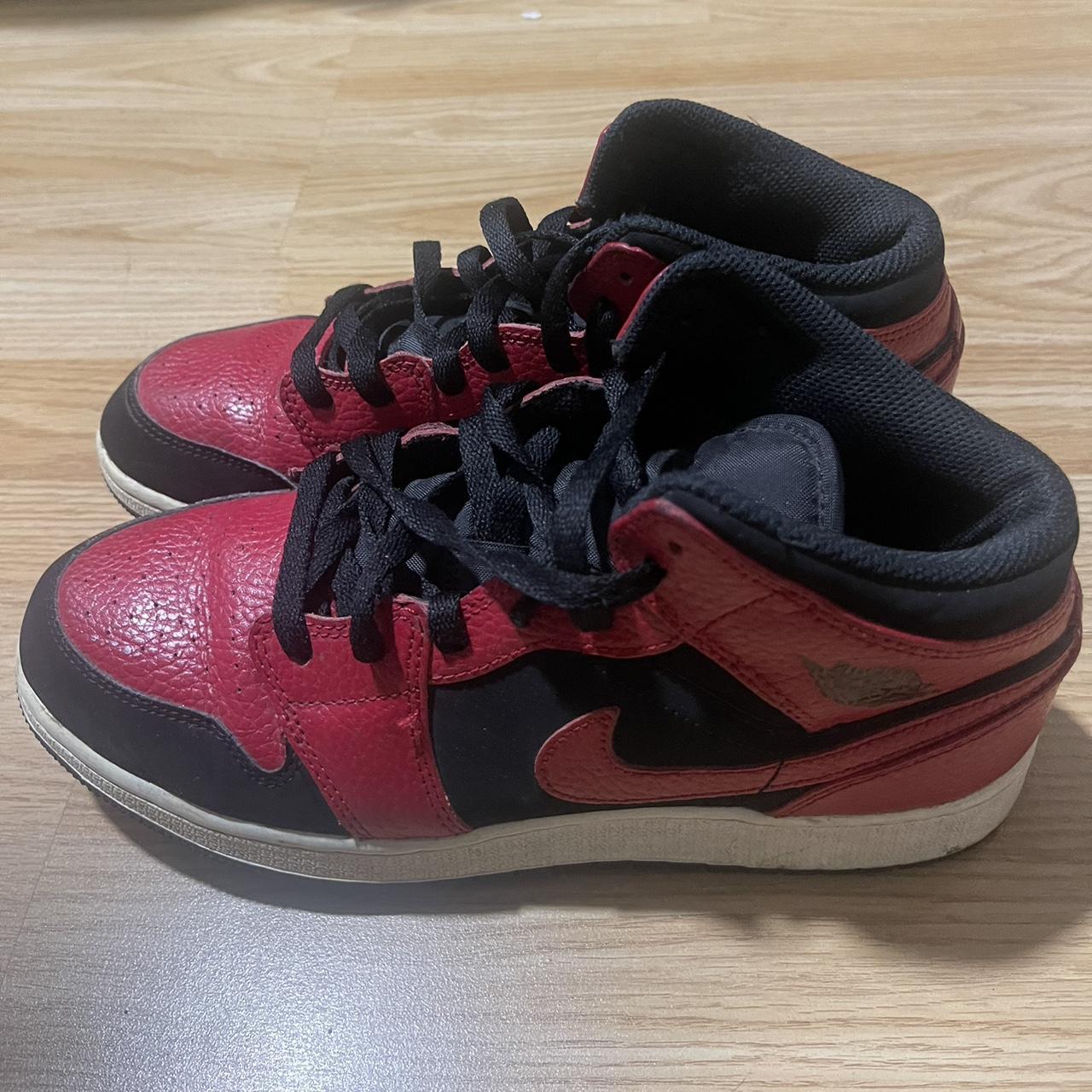 half black half red jordan ones