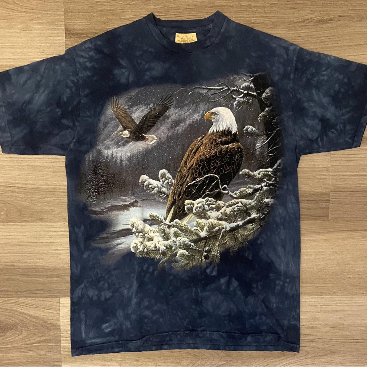 This is a The Mountain Bald Eagles in the Snow T... - Depop