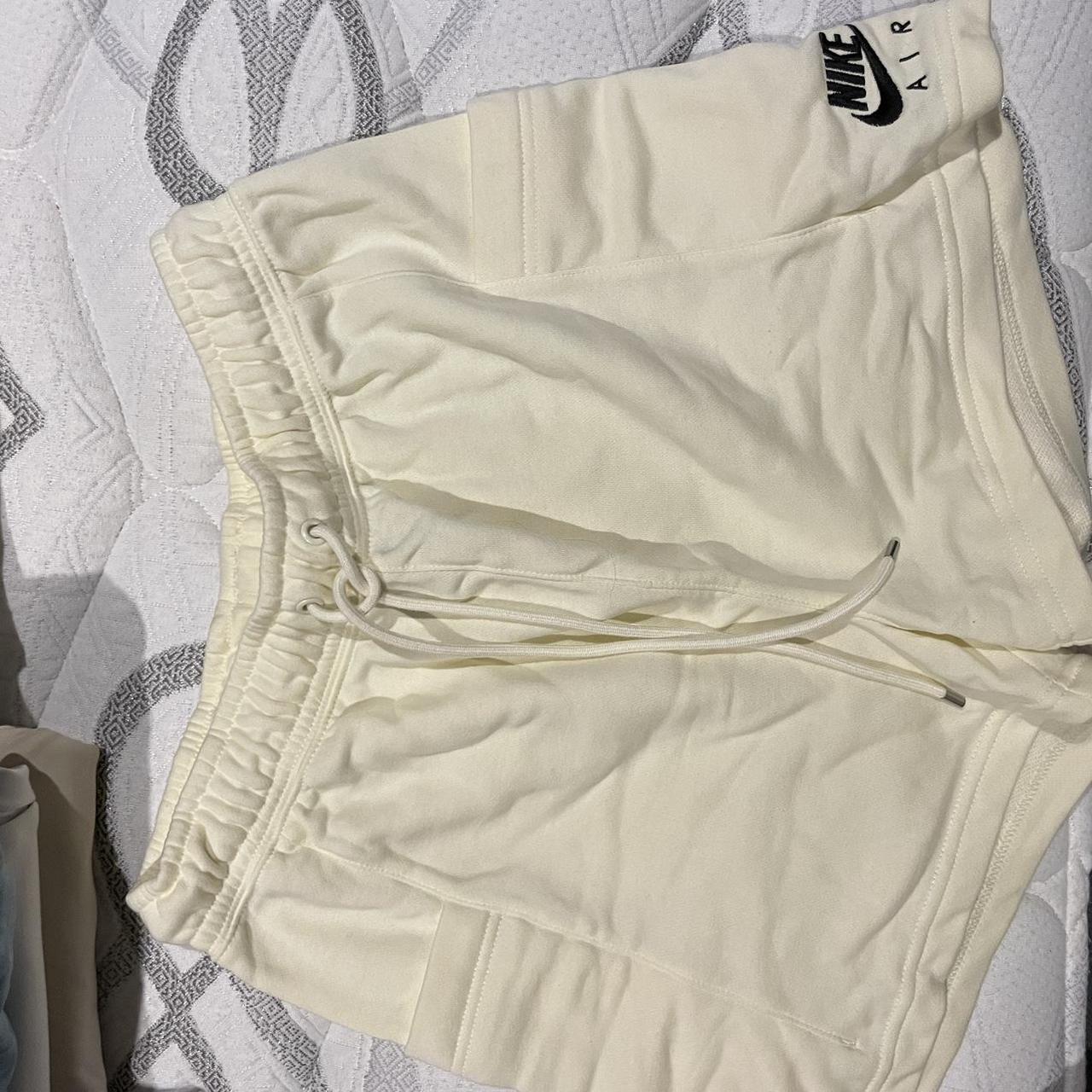 Cream Nike shorts with pockets S - Depop