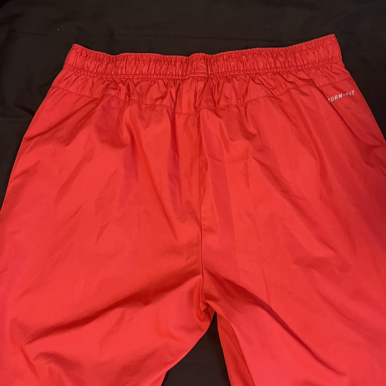 red nike track pants size medium - Depop