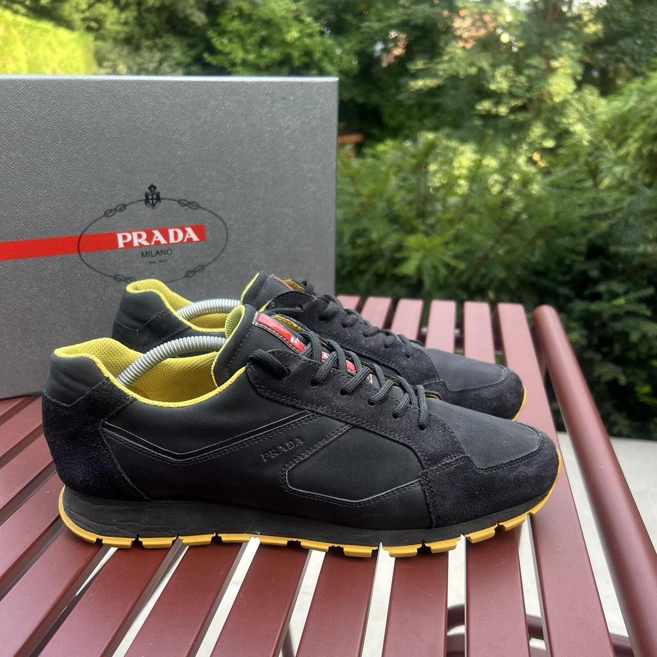 Prada mens runner trainers in black with yellow. Depop