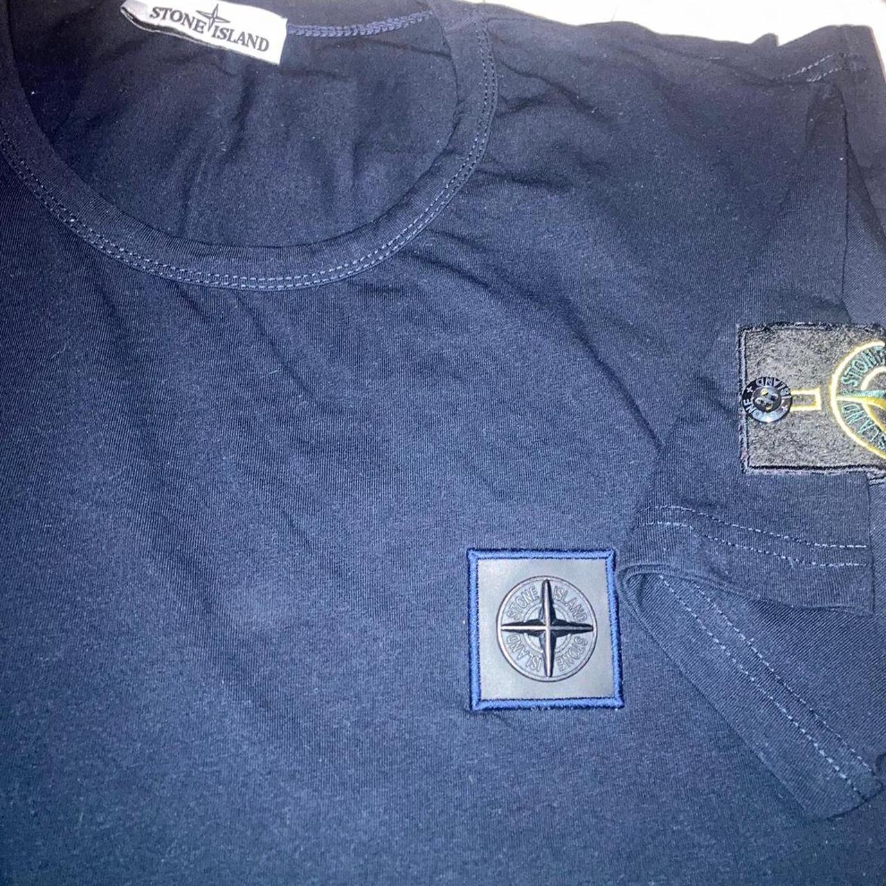 Stone island badge on sale shirt