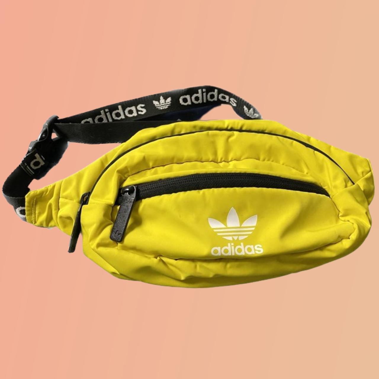 Yellow adidas waist bag for athletic wear and... Depop